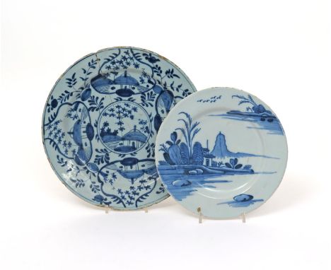 A Dublin delftware plate  mid 18th century, painted in blue with a Chinese landscape of a tall mountain behind a low pagoda, 