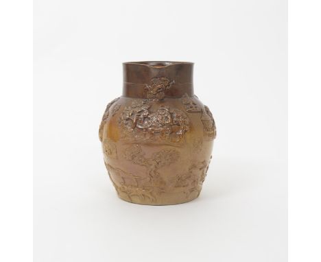 A large brown stoneware hunting jug  19th century, Brampton or Fulham, sprigged with a toper drinking at a table above a scen