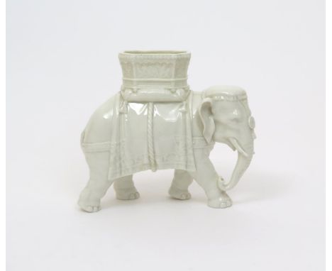 A Royal Worcester vase in the form of an elephant  c.1880, modelled by James Hadley, wearing a large open caparison, faint im