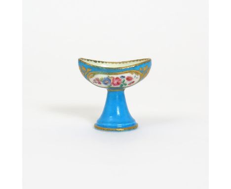A Sθvres eyebath  c.1760, each side of the bowl painted with a panel of rose, convolvulus and primrose reserved within gilt b