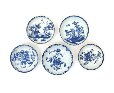 Five Lowestoft blue and white saucers  c.1770-80, one painted with small buildings in a Chinoiserie landscape, one with a rar