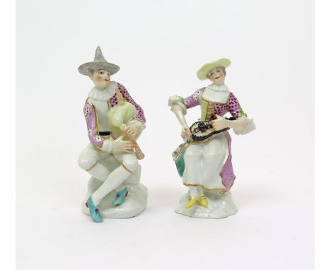A pair of Vienna figures of Harlequin and Columbine  2nd half 18th century, after Kδndler's models at Meissen, he seated and 