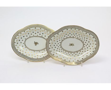 A pair of Caughley stands or dishes  c.1790, of quatrefoil form, decorated with a single gilt sprig to the centre within a wi