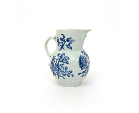 A Worcester blue and whuite mask jug  c.1765, printed with the Natural Sprays group of loose rose, chrysanthemum and convolvu