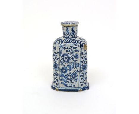 A Delftware tea canister and cover  late 17th/early 18th century, of chamfered rectangular form, painted in blue with sprays 