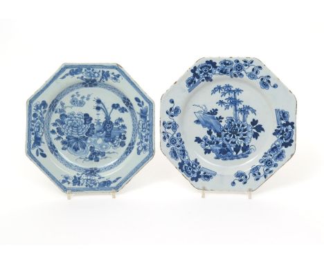 Two Dublin delftware octagonal plates  mid 18th century, both painted in blue, one with a large peony spray beside a vase of 