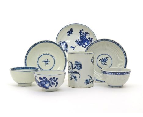 Three Worcester blue and white teabowls and saucers  c.1770-80, two decorated with simple floral sprigs within cell diaper bo