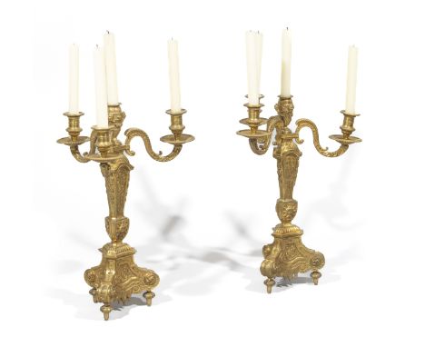 PAIRE DE CANDELABRES DE STYLE REGENCE EN BRONZE DORE A QUATRE LUMIERES XIXe SIECLEA PAIR OF REGENCE STYLE ORMOLU FOUR BRANCH 