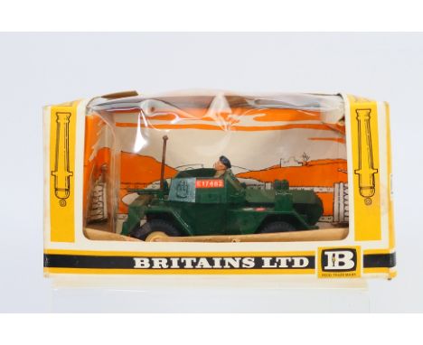 Britains - A boxed British Military Scout Car # 9781. The model appears Mint with original sticker sheet in a Good box with s
