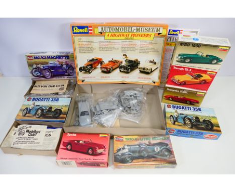Airfix - Revell - Lindberg - Nine boxed vintage plastic model car kits in 1:32 scale. Lot includes Lindberg #605 Triumph TR3;