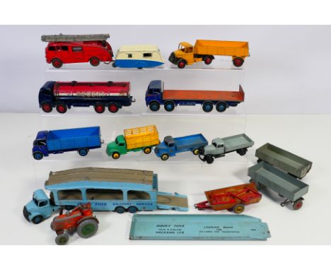 Dinky - A collection of unboxed vehicles including Guy Lorry # 511, Foden Lorry with Tailboard # 503, Field Marshall Tractor 