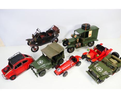 Modern metal ornamental vehicles including: US army jeeps, racing car, classic vehicle, etc. Largest approx 22 cm x 34 cm. It