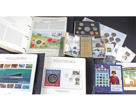 Collection of coins, to include the History of World War II coin and stamp set, in three leather bound albums, together with 