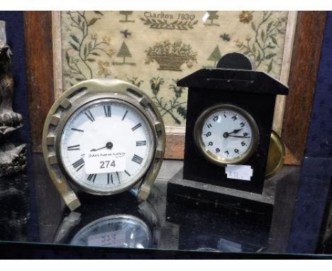 A CIRCULAR FACE MANTEL CLOCK in 'Lucky Horseshoe' mount and another similar