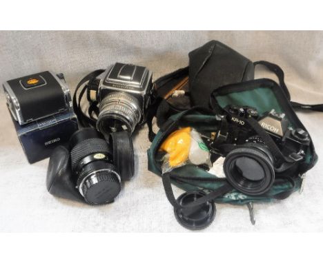 A HASSELBLAD LARGE FORMAT CAMERA and another