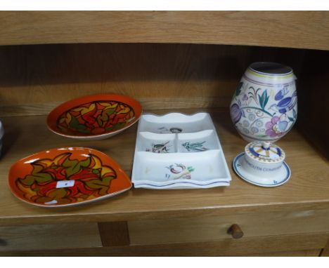 A POOLE POTTERY 'DELPHIS' EYE DISH, shape 91, decorated in an abstract design, and with a 'Delphis' bowl and three traditiona