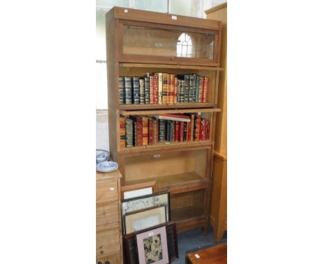 A LIGHT OAK GLOBE WERNICKE BOOKCASE with five glazed sections, 77.5" high x 34.5" wide