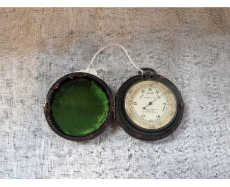 A LEATHER CASED POCKET BAROMETER by James Lucking & Co