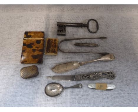 A SILVER HANDLED FRUIT KNIFE carved with a man holding a serpent and a collection of other ephemera including a silver caddy 