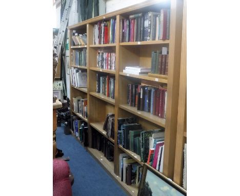A LARGE CONTEMPORARY LIGHT OAK BOOKCASE, with three sections, each with fully adjustable shelves, 80" high x 120" long x 13" 