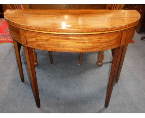 A GEORGE III MAHOGANY AND ROSEWOOD CROSSBANDED FOLD OVER TOP DEMI-LUNE CARD TABLE,38.5'' high