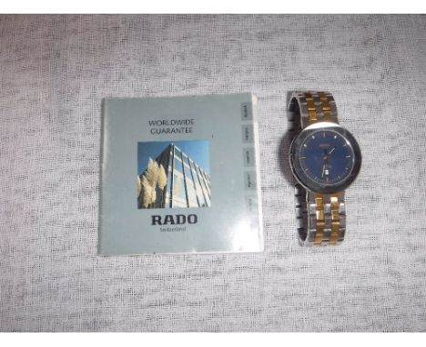 RADO OF SWITZERLAND: A GENTLEMAN'S WRISTWATCH with a gold and silver coloured Titanium strap, watch serial no. 02382178