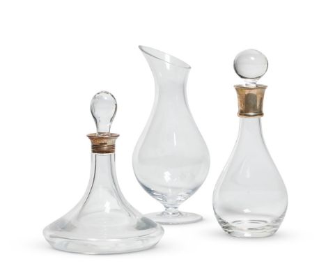 TWO MODERN STERLING SILVER-MOUNTED DECANTERS AND STOPPERS HALLMARKED FOR SHEFFIELD 2002 AND LONDON 2012 25cm high and 31.5cm 