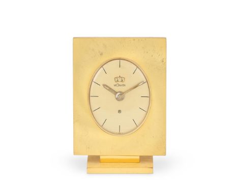 LECOULTRE  A GILT METAL DESK TIMEPIECE WITH ALARM MODERN With an 8 day manual wind alarm movement, the oval champagne dial wi