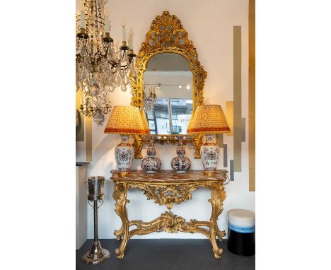 A giltwood mirror, c.1850, Italian, the split mirror plate within an ornately carved and pierced giltwood frame, 102cm wide10