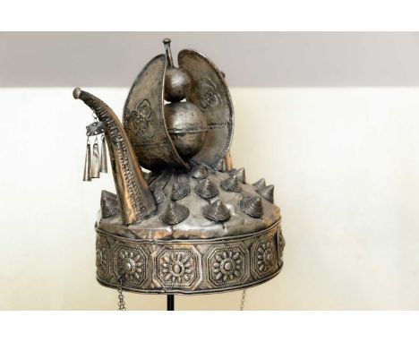 A silver metal ceremonial headdress, 20th century, Chinese, Miao, on a hardwood display hat stand,28cm diameter43cm high (2)