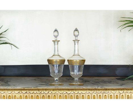A pair of Saint Louis ‘Thistle’ glass decanters, c.1960, French, each with gilt decoration,13cm diameter39cm high (2)Conditio