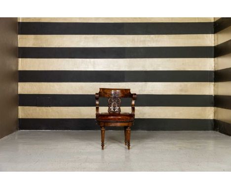 A Louis Philippe walnut office chair, c.1850, French, the carved splat above a leather upholstered seat, on turned and fluted