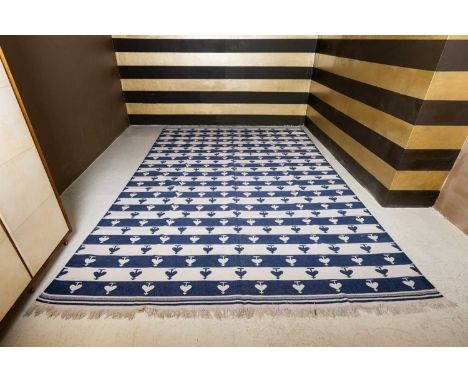 A flat-weave dhurrie,  of recent manufacture, with banded decoration interspersed with heart motifs, 450 x 305cm  Condition R