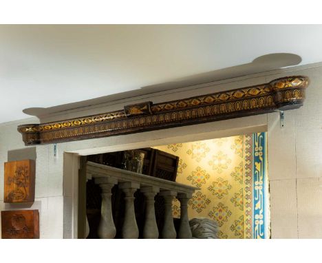 A black and gilt-lacquer curtain pelmet, 19th century, decorated with stylised flowers, foliage and a central cornucopia, 216