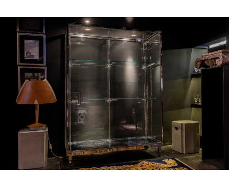 A chrome display cabinet, c.1940, French, with a mirrored back and adjustable shelves,131cm wide50cm deep178cm highCondition 