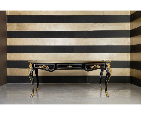 A Louis XV-style ebonised bureau plat,  c.1880, French, with gilt-bronze mounts and original tooled and gilt-leather top, gil