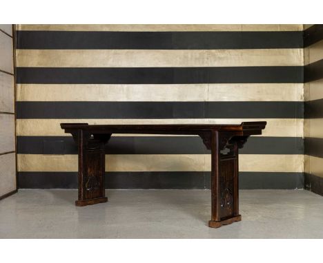 An elm altar table,  c.1880, Chinese, Shanxi Province, with carved enclosed ends, 239cm wide 41cm deep 90cm high  Condition R