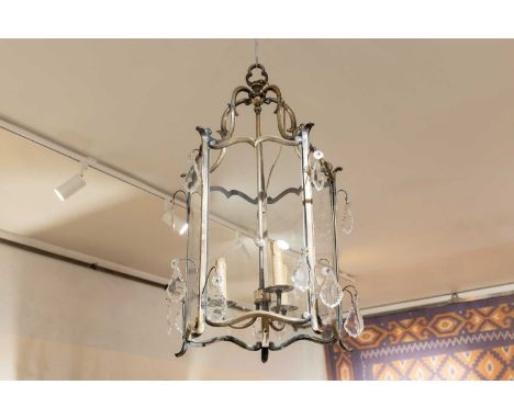 A Louis XV-style gilt-bronze hall lantern, 20th century, French, the scrolled supports above five shaped glass panels, enclos