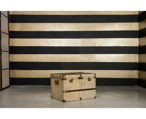 A vellum, brass and wood-mounted cabin trunk, 20th century, with brass side handles,79cm wide59cm deep53cm high