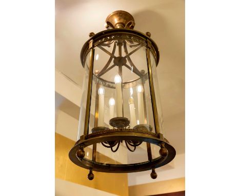 A bronze lantern, c.1900, French, the neoclassical cylindrical frame with a suspended five-branch light,47cm diameter107cm hi