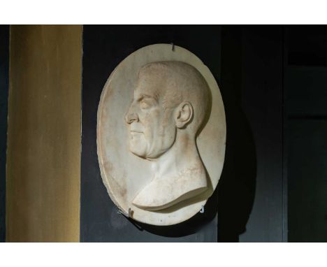 A marble portrait relief, 19th century, Italian, the oval panel carved with a man in profile,36cm wide6cm deep46cm highCondit