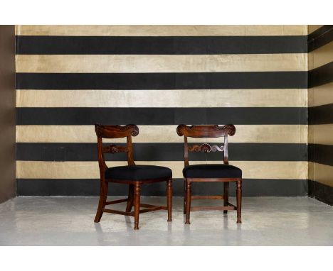 A set of six William IV mahogany dining chairs, first half of the 19th century, each with a scroll-carved top rail and shell-