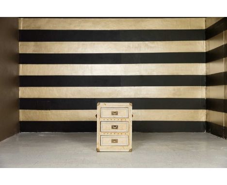 A vellum-covered trunk, of recent manufacture, fitted with three drawers, brass mounts and leather handles, 51cm wide51cm dee