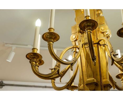 A Louis XVI-style bronze chandelier, c.1950, French, after a design by Jean-Charles Delafosse, with twelve scrolling branches
