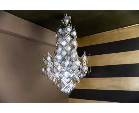 A 'brutalist' Murano glass and steel chandelier, c.1970, Italian, with occluded glass pendants,70cm diameter115cm highConditi