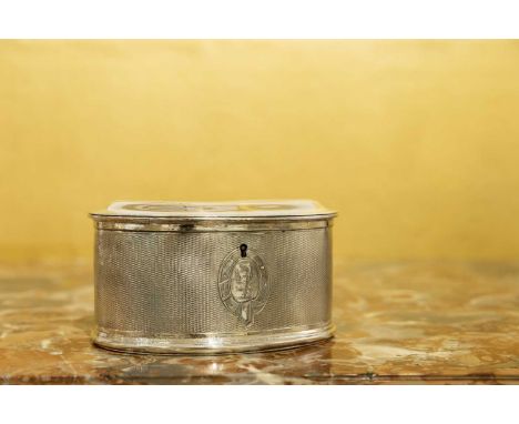 A silver-plated oval tea caddy, c.1920, with engine-turned decoration and an oval crest, 16cm wide11.5cm deep8cm high
