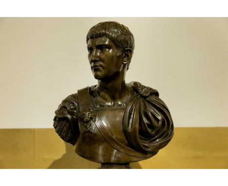 A grand tour bronze bust of Augustus, 19th century, raised on an associated wooden base,30cm wide16cm deep50cm high (2)Condit