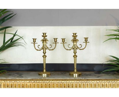 A pair of Louis XVI-style ormolu candelabra, c.1880, French, each with three scrolling branches and cast with eagle heads, on
