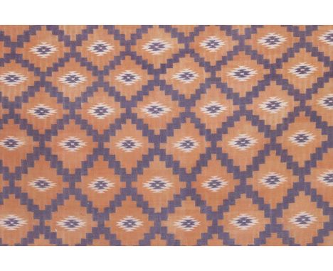 A flat-weave dhurrie, 20th century, Indian, decorated in lavender with a stepped trellis pattern, on a pale orange ground,442