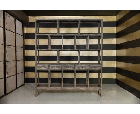 A provincial elm open shelf, c.1900, Chinese, Shanxi Province, incorporating a tier of five short drawers,200cm wide40cm deep